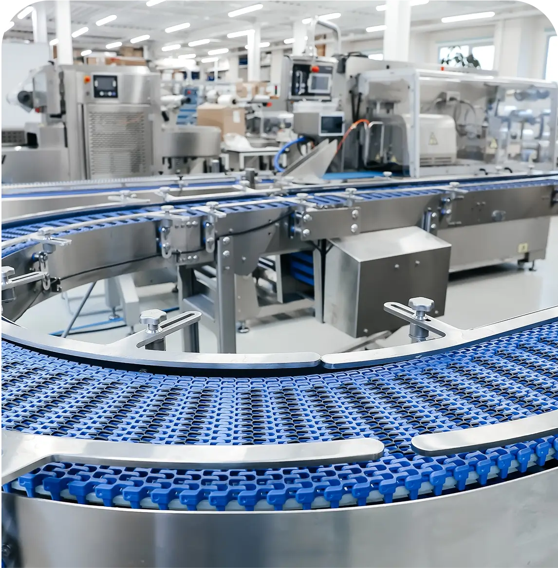 Factory conveyor system with blue belt.