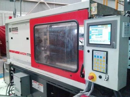 Plastic injection molding machine with control panel.
