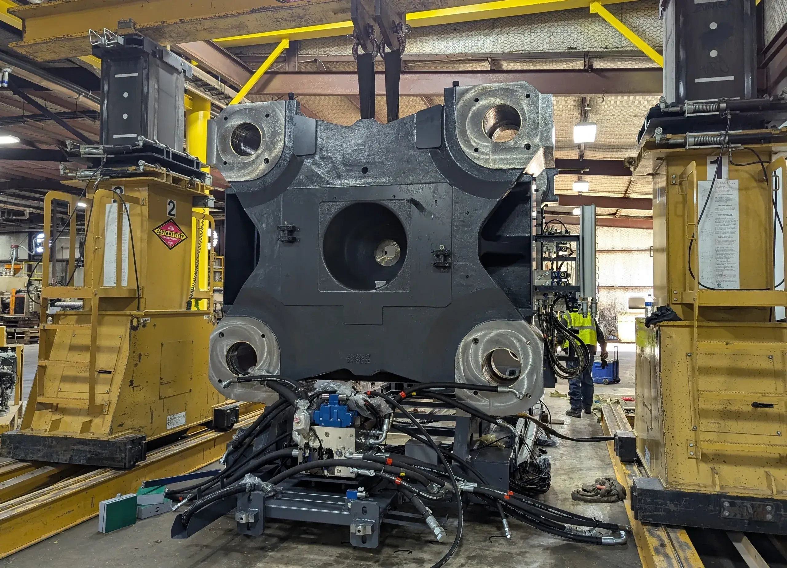 Heavy machinery in an industrial warehouse setting.
